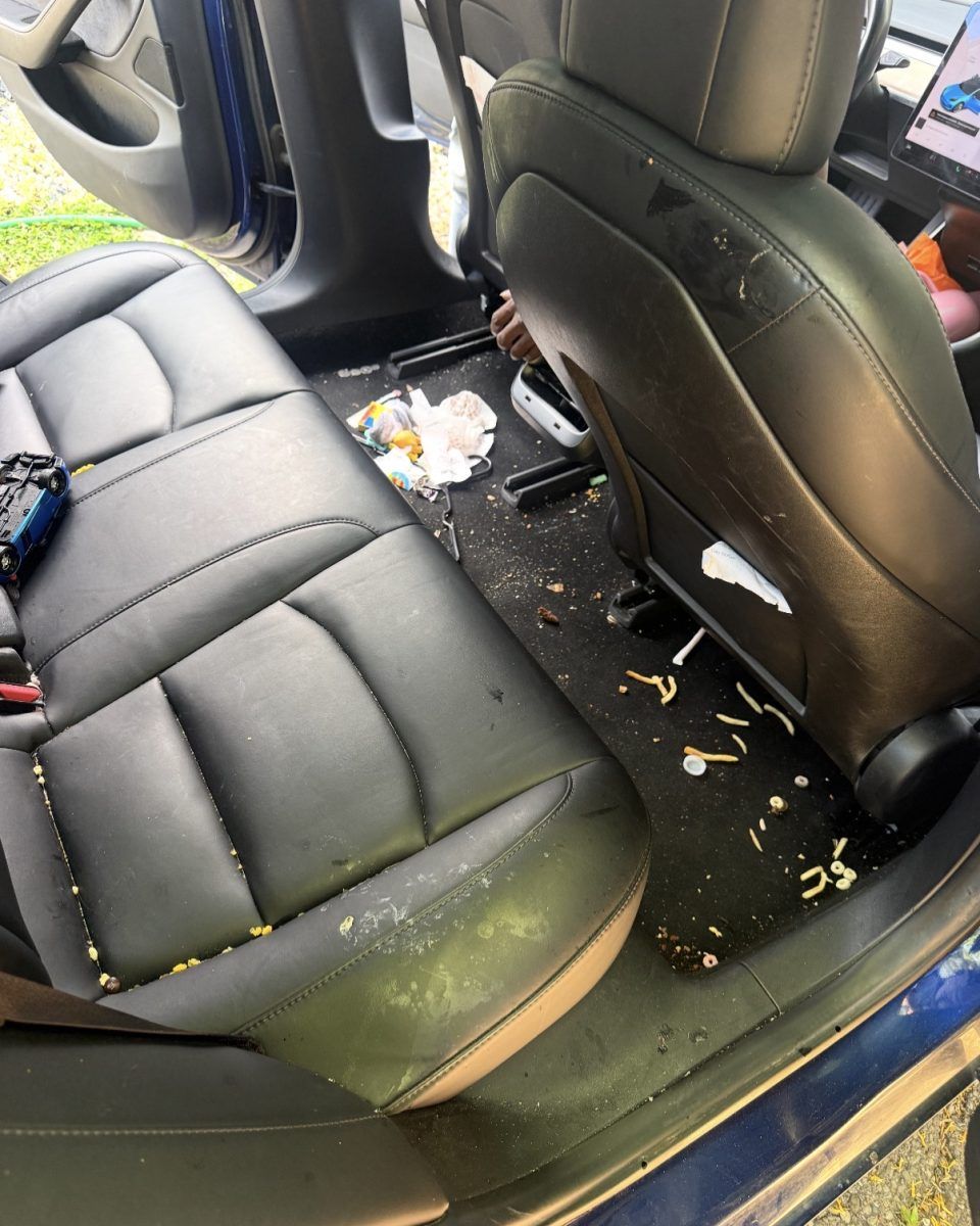 Rear seat and floor with crumbs and trash