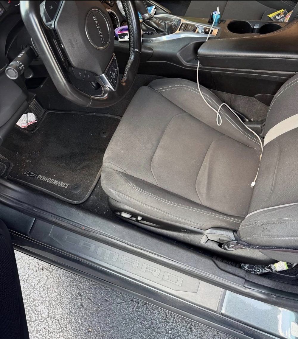 Camaro driver seat and floor mat before detailing