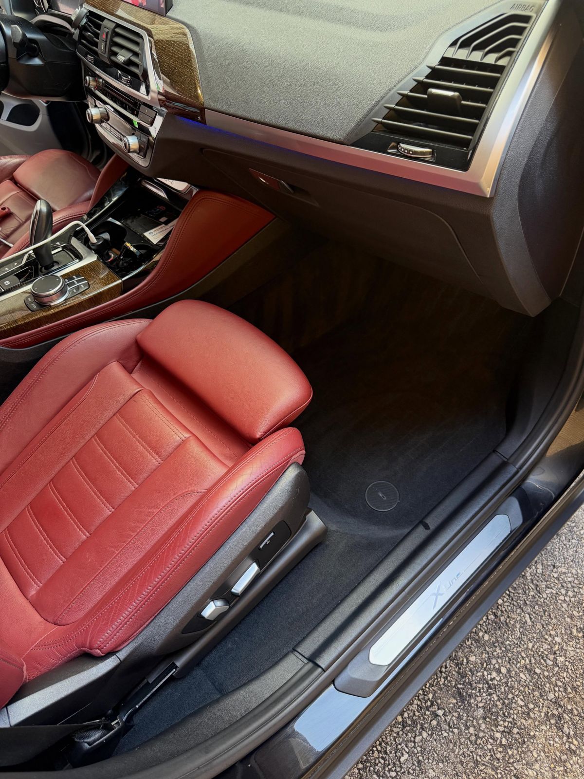 Red leather BMW X4 seat after leather cleaning